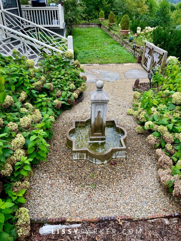 Greenhouse and gravel patio