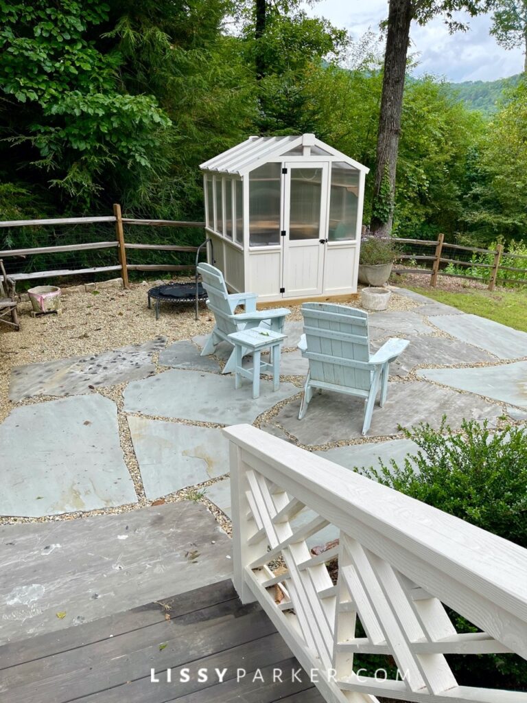 Greenhouse and gravel patio