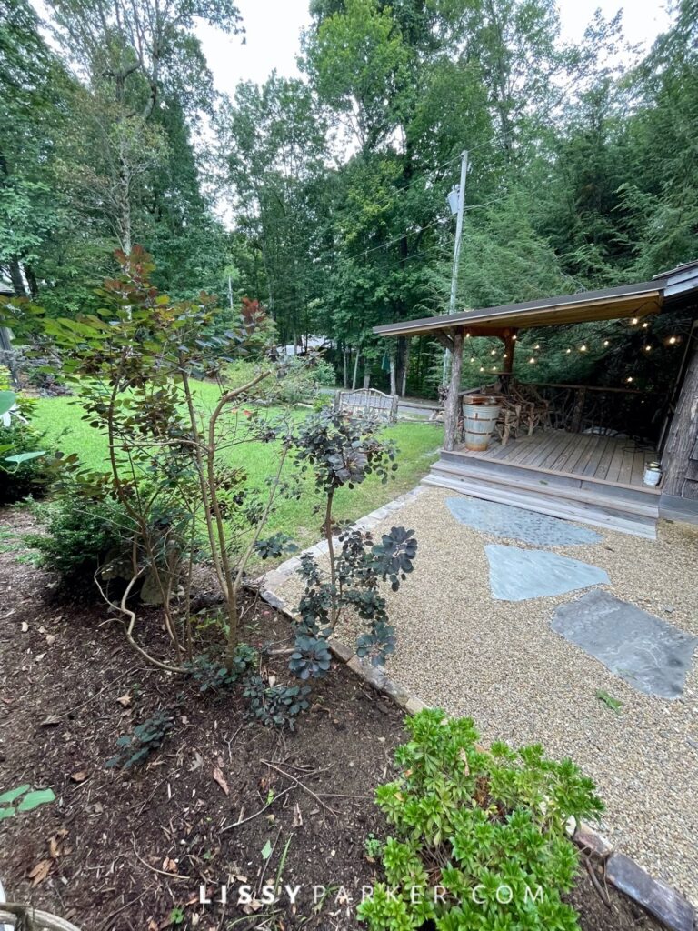 Greenhouse and gravel patio