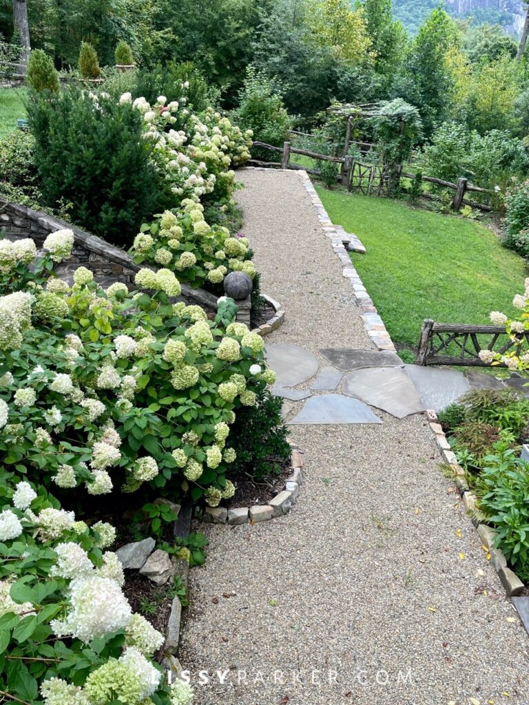 Greenhouse and gravel patio